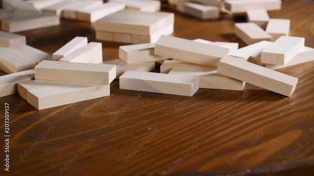 The wooden blocks on the table. .Jenga game. selective focus The wooden blocks on the table. .Jenga game. selective focus