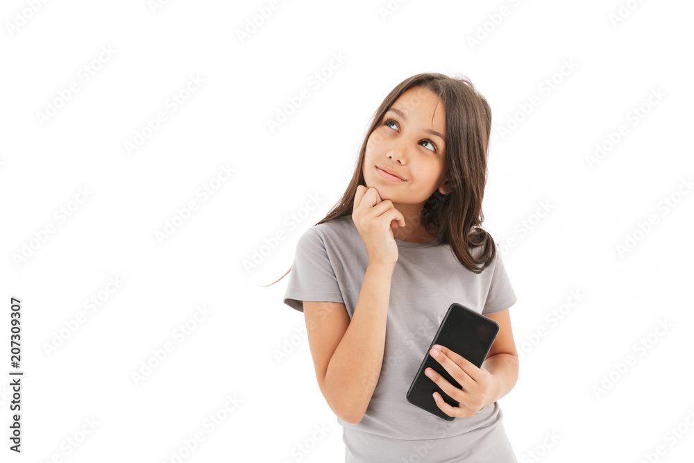 Cute girl standing isolated using mobile phone. Cute girl standing isolated using mobile phone.