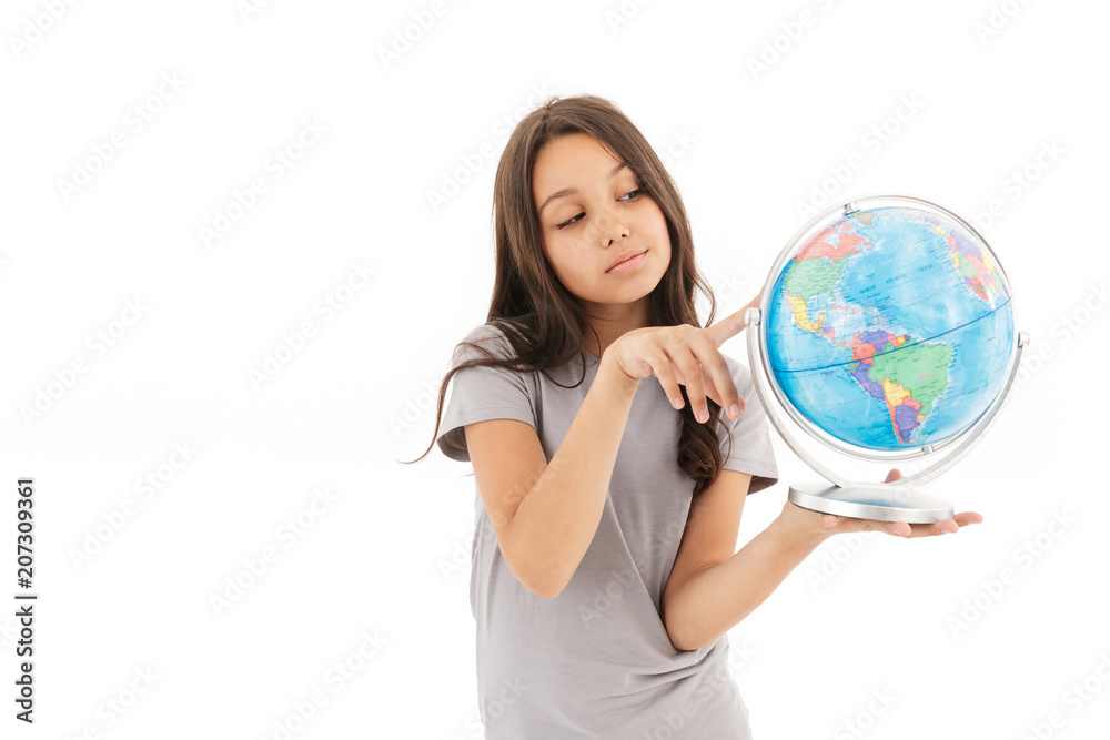 Cute girl standing isolated holding globe. Cute girl standing isolated holding globe.