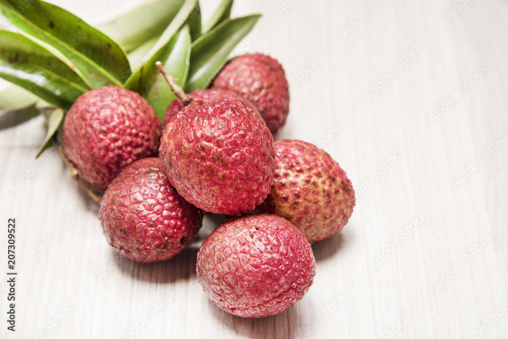 Lychee on wooden floor Lychee on wooden floor