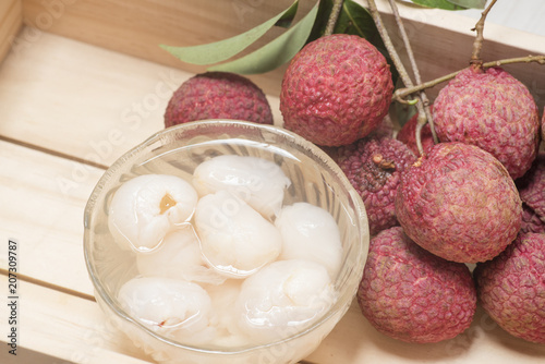 fresh lychees in a wooden box