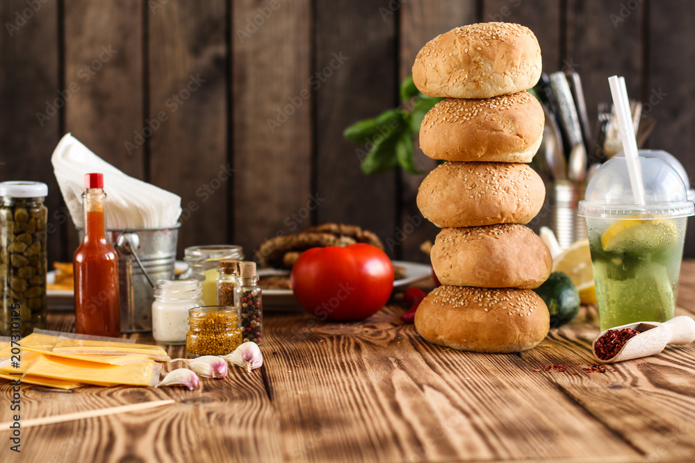 burgers with meat, tomato and lettuce leaves - fast food (sandwich) - cuisine. Food background burgers with meat, tomato and lettuce leaves - fast food (sandwich) - cuisine. Food background