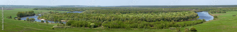 Obraz premium Landscape in the valley of the Don River in central Russia. Top view of the spring meadow with grass and pond.