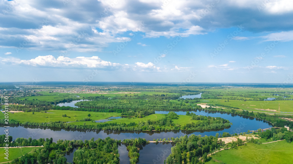 Aerial top view of Kyiv cityscape, Dnieper and Dniester river, green island from above, Kiev city skyline and nature parks in spring, Ukraine
