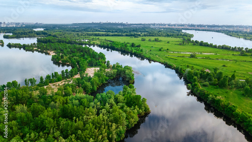 Aerial top view of Kyiv cityscape, Dnieper and Dniester river, green island from above, Kiev city skyline and nature parks in spring, Ukraine 