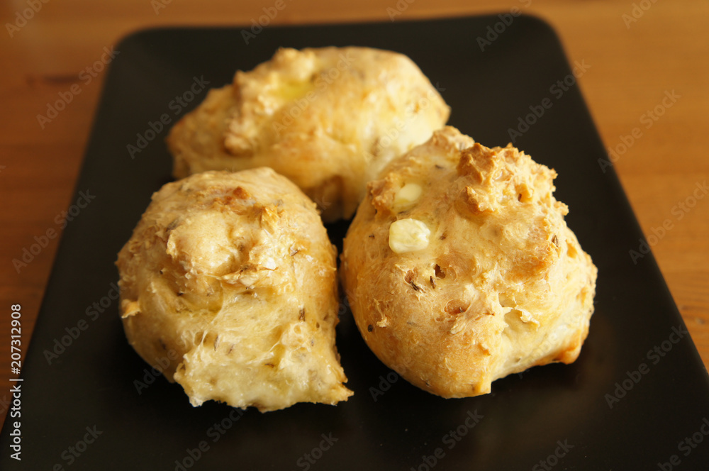 Three breads buns on black plate Three breads buns on black plate