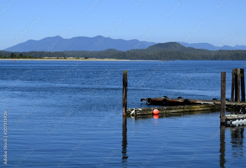 Fototapeta premium View across the bay towards islands and Mountains,, seen from Tofino, Vancouver Island