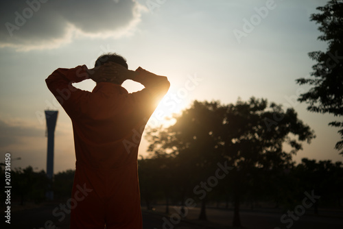 Fényképezés Silhouette Portrait of asian handsome man in Prison uniforms,He has a lot Mustac