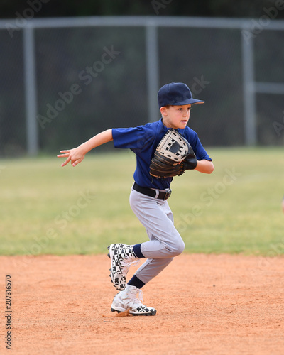 Young boy playing youth baseball
