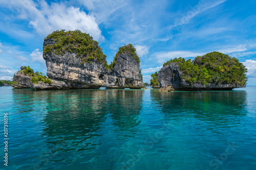 East Misool, group of small island in shallow blue lagoon water, Raja Ampat, West Papua, Indonesia photo