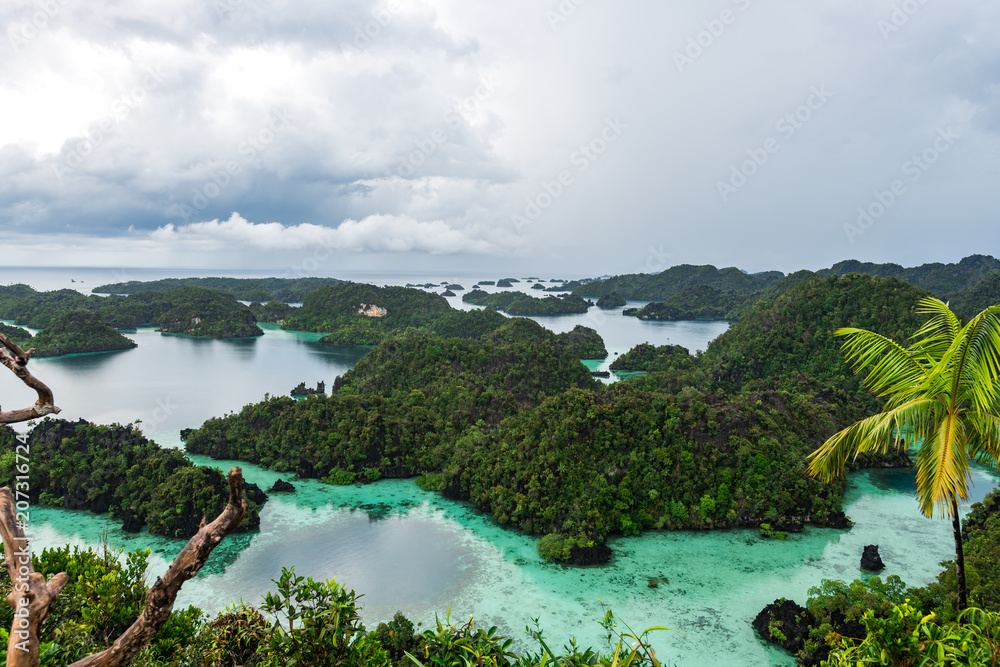 East Misool, group of small island in shallow blue lagoon water, Raja Ampat, West Papua, Indonesia
