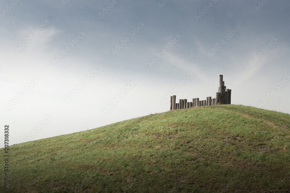 Green hill with poles Green hill with poles