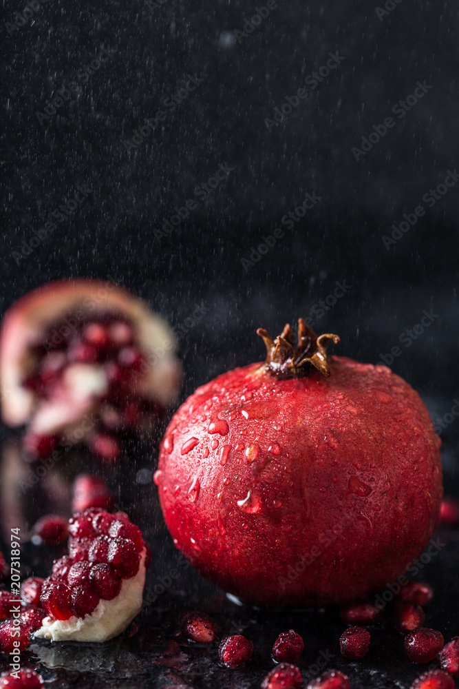 Red juice pomegranate on dark background. Useful pomegranate Red juice pomegranate on dark background. Useful pomegranate