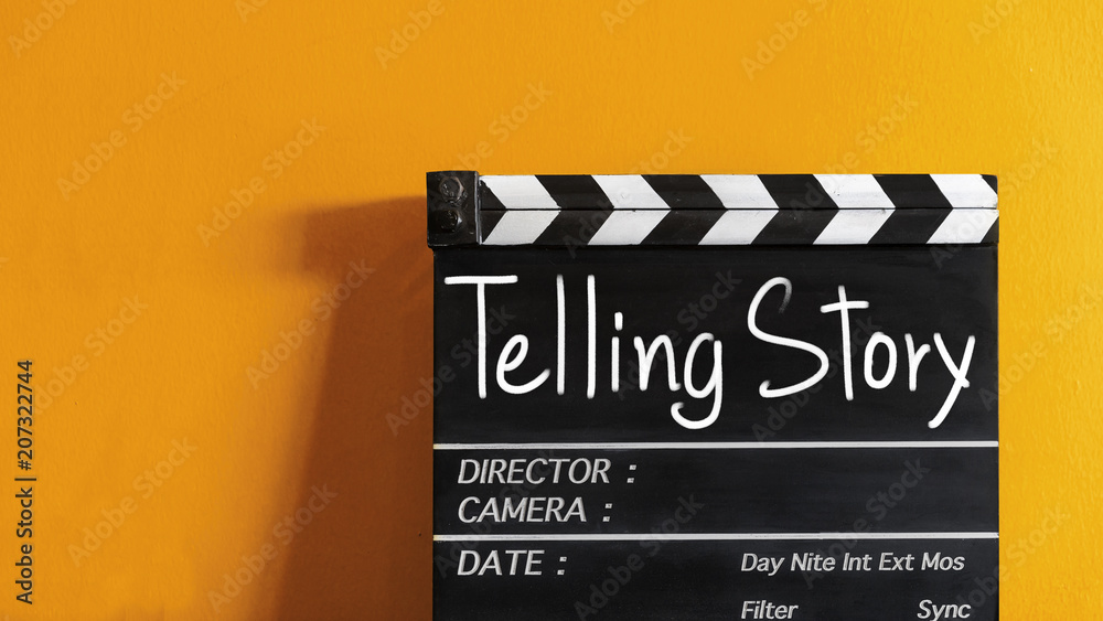  telling story text title on wooden clapper board