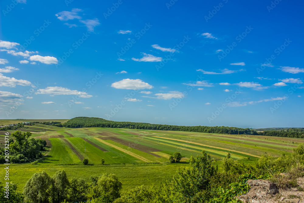 green spring nature landscape with agrarian agricultural field near village green spring nature landscape with agrarian agricultural field near village