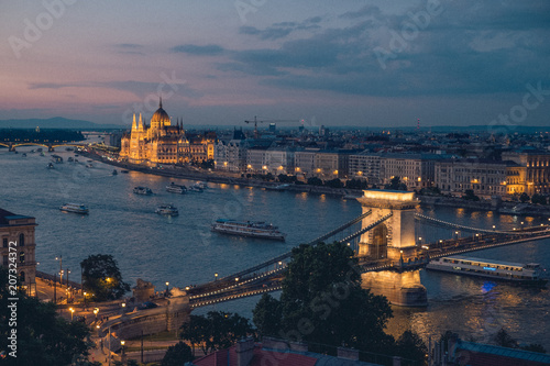 Beautiful view on the Danube promenade  Parliament and chain bridge at dusk  Budapest 