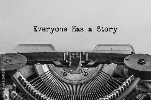 Everyone has a story, typed words on a vintage typewriter. old paper. close-up