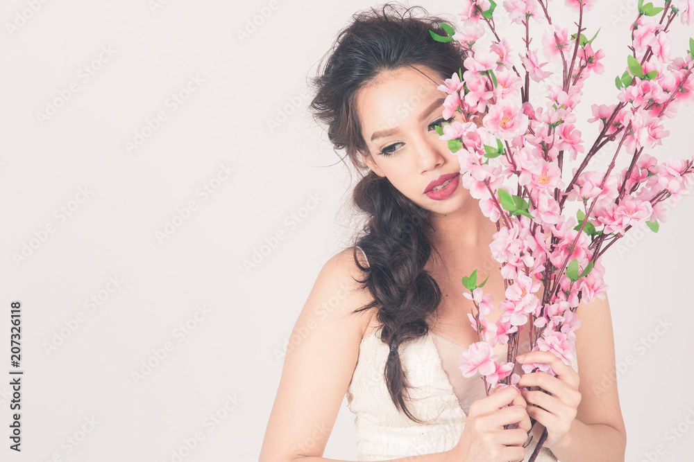 Beautiful Asian woman ware wedding dress holding a bouquet with copy space. process for vintage film color