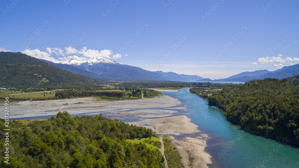 Patagonian natural landscape, surrounded by mountains and the river Puelo with its characteristic turquoise color