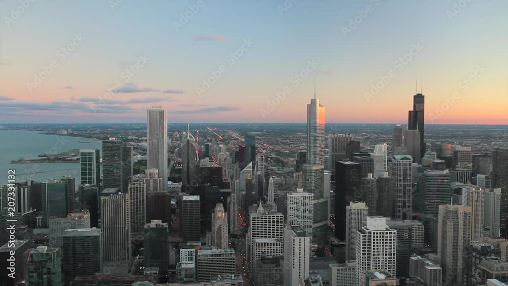High angle view of Chicago skyline and suburbs looking south in the evening, Chicago, Illinois, USA. High angle view of Chicago skyline and suburbs looking south in the evening, Chicago, Illinois, USA.