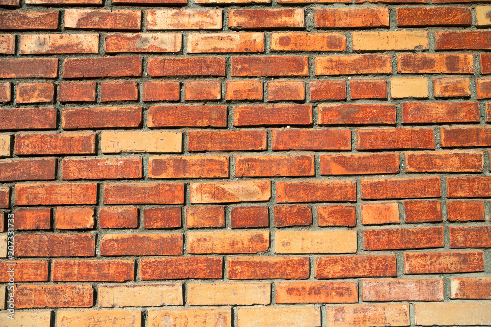 Fototapeta premium Weathered stained old brick wall