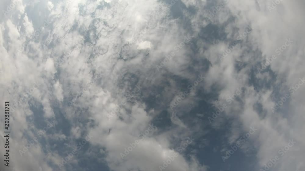 Time lapse of cloudscape with bright sun shining and revealing itself behind clouds. Time lapse of cloudscape with bright sun shining and revealing itself behind clouds.