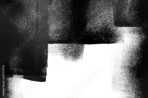 Fototapeta Naklejka Na Ścianę i Meble -  White wall partially painted in black with a paint roller