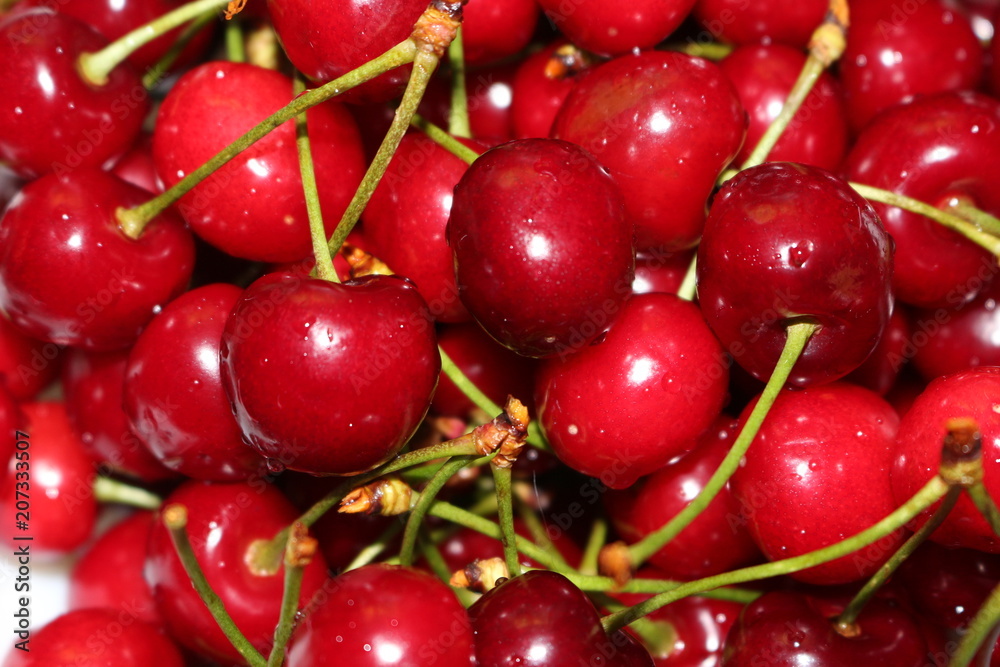 Red ripe cherry lies on a plate Red ripe cherry lies on a plate
