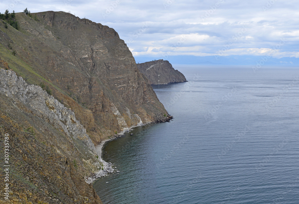 Landscape of high rocks over lake Baikal.