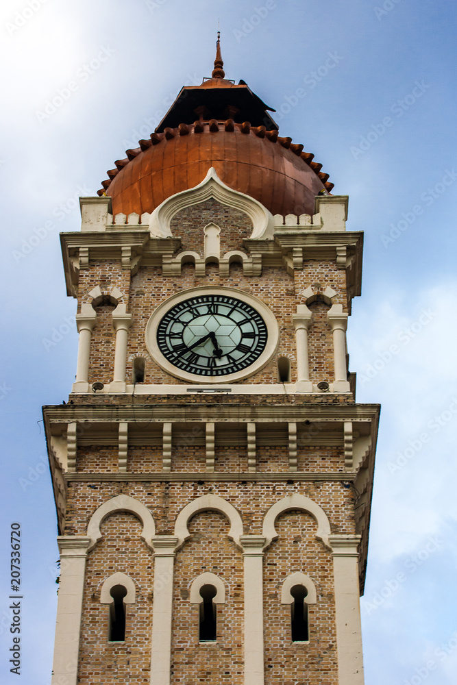 Clock tower Sultan Abdul Samad over cloudy sky
