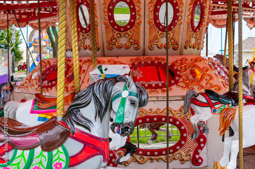 Merry go round horses at the carnival © Kristen