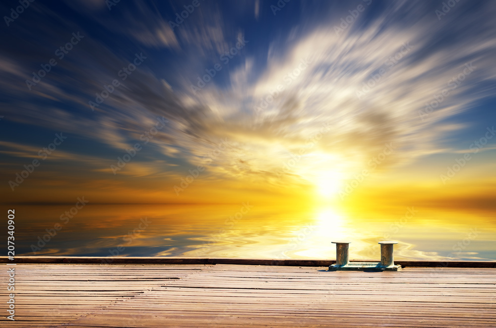 Solar decline on the sea, a kind from a wooden mooring. Solar decline on the sea, a kind from a wooden mooring.