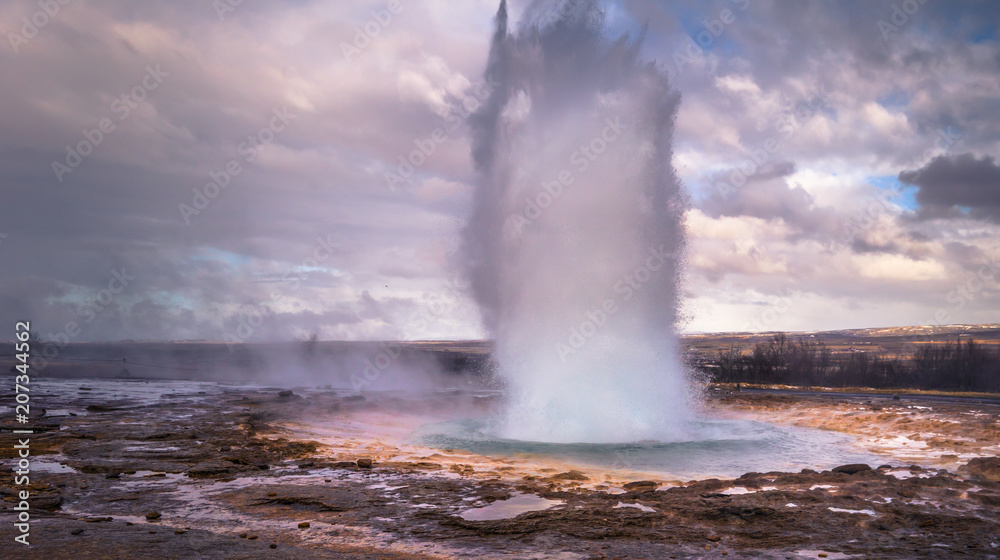 Geysir - May 03, 2018: A tall geyser eruption at Geysir, Iceland Geysir - May 03, 2018: A tall geyser eruption at Geysir, Iceland