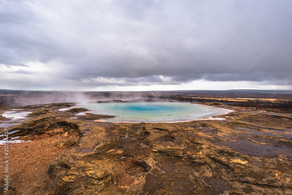 Geysir - May 03, 2018: Hot thermal water pool in the Geysir park, Iceland Geysir - May 03, 2018: Hot thermal water pool in the Geysir park, Iceland