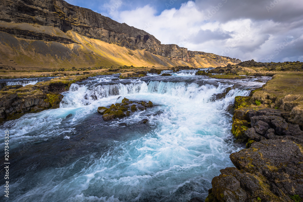 Icelandic wilderness - May 05, 2018: Beautiful waterfall in the wilderness of Iceland
