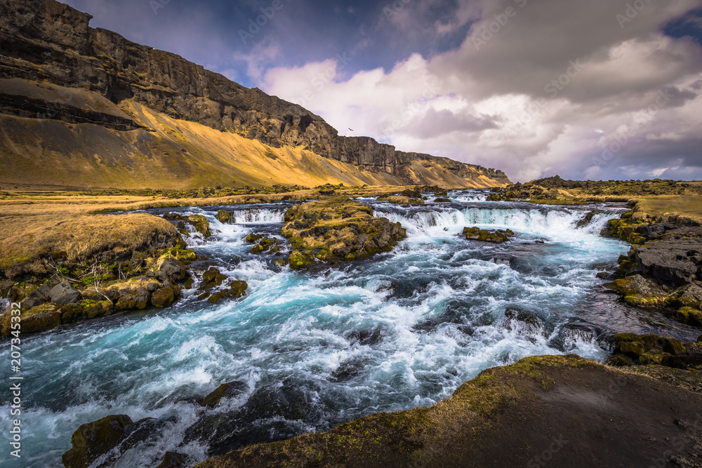 Icelandic wilderness - May 05, 2018: Beautiful waterfall in the wilderness of Iceland