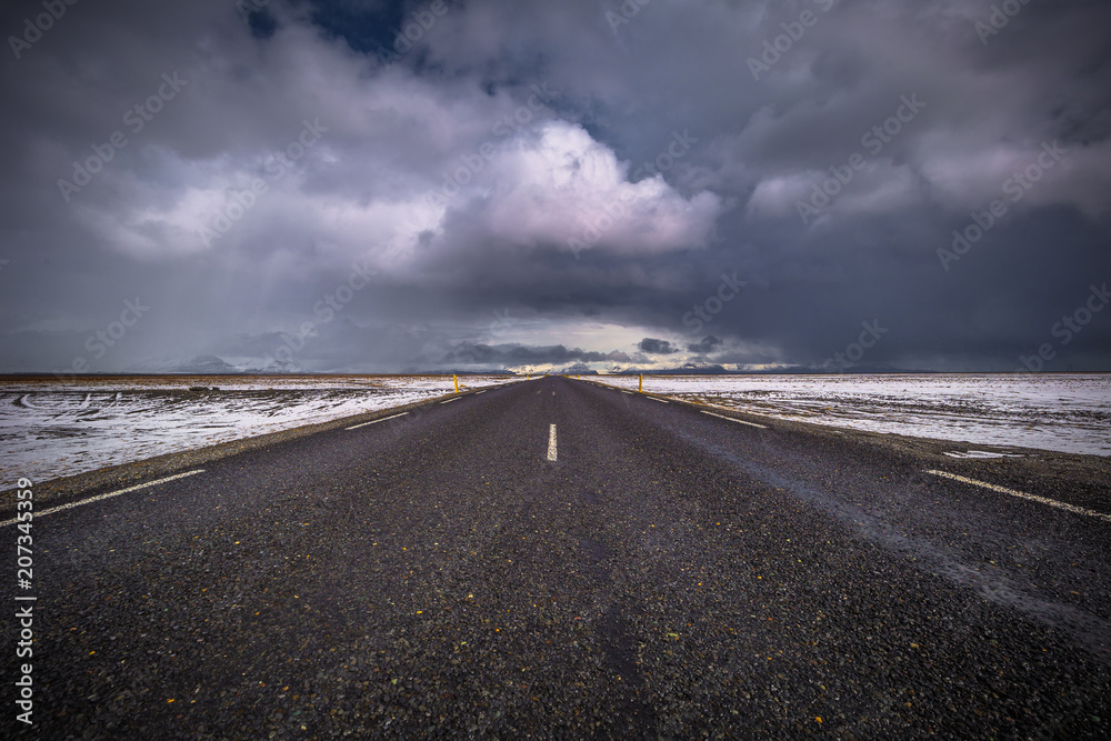 Icelandic wilderness- May 05, 2018: A lonely road in the wild landscape of Iceland Icelandic wilderness- May 05, 2018: A lonely road in the wild landscape of Iceland