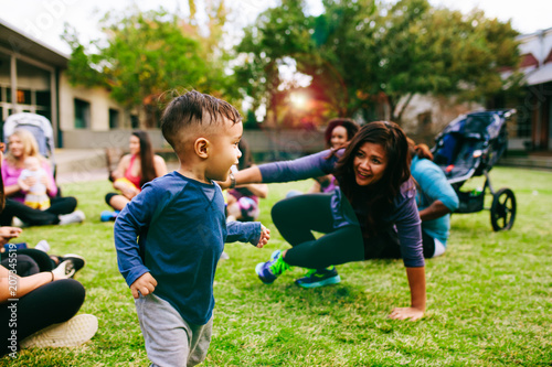 Women playing with their children in the park