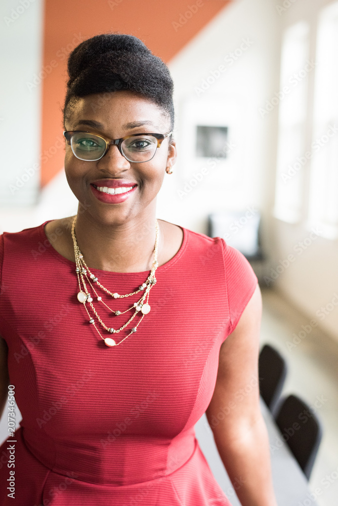 Portrait of smiling businesswoman standing in office Portrait of smiling businesswoman standing in office