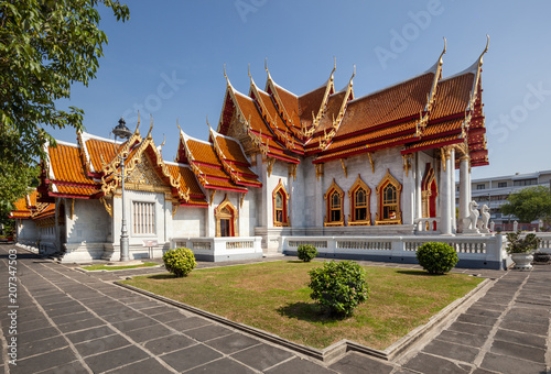 The beautiful facade of Wat Benchamabophit     designed by the half brother of King Chulalongkorn  Prince Naris  in 1899 it is contructed of Italian marble