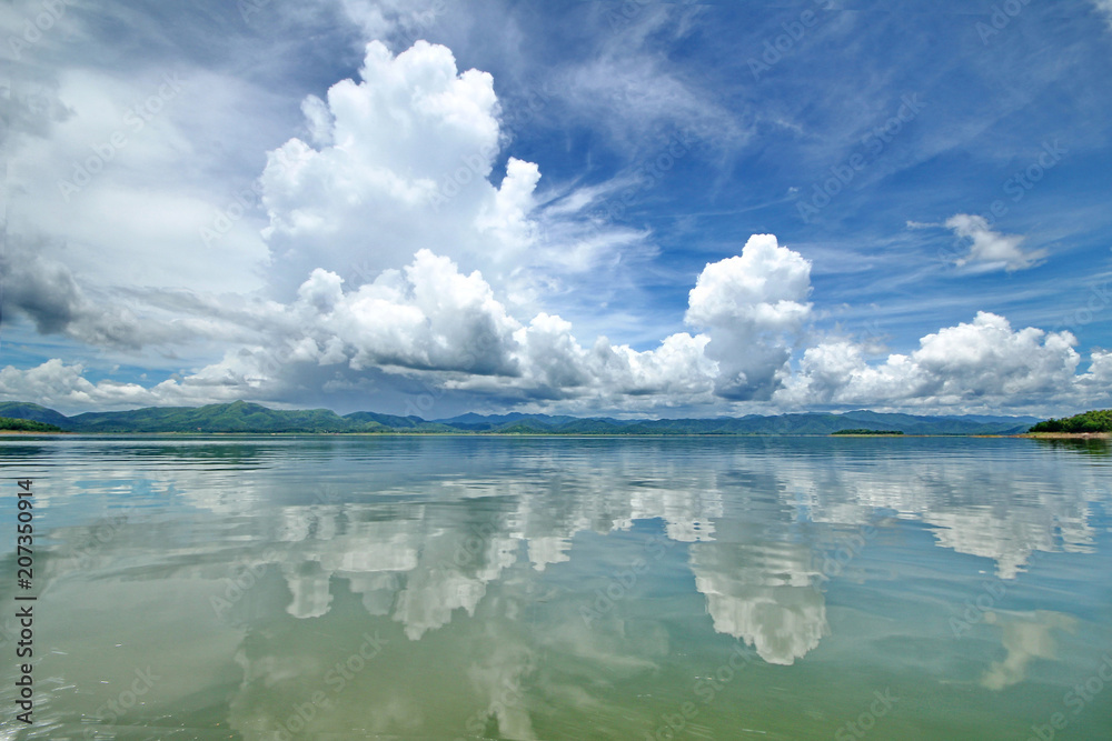 The Islands and mountains on reservior in dam. On the day of clouds and cloud reflection in the beautiful water of  KaengKrachan National Park.