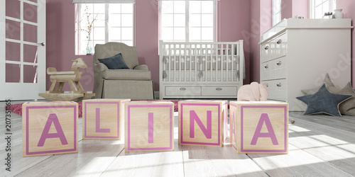 The name alina written with wooden toy cubes in children's room