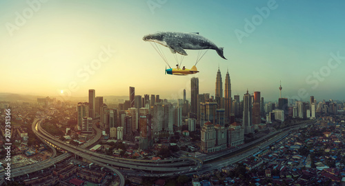 Fotografie Whale floats in the sky and carrying a plane with two young little sister