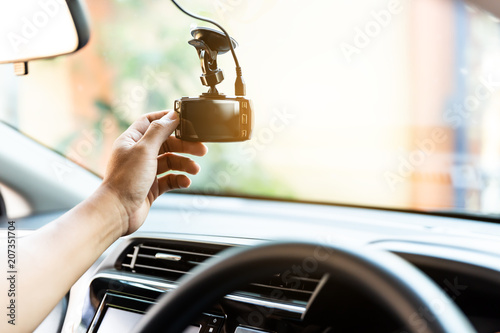 Obraz na płótnie Camera car recorder in car,hand hold and touch to check the work Car Camera w salonie