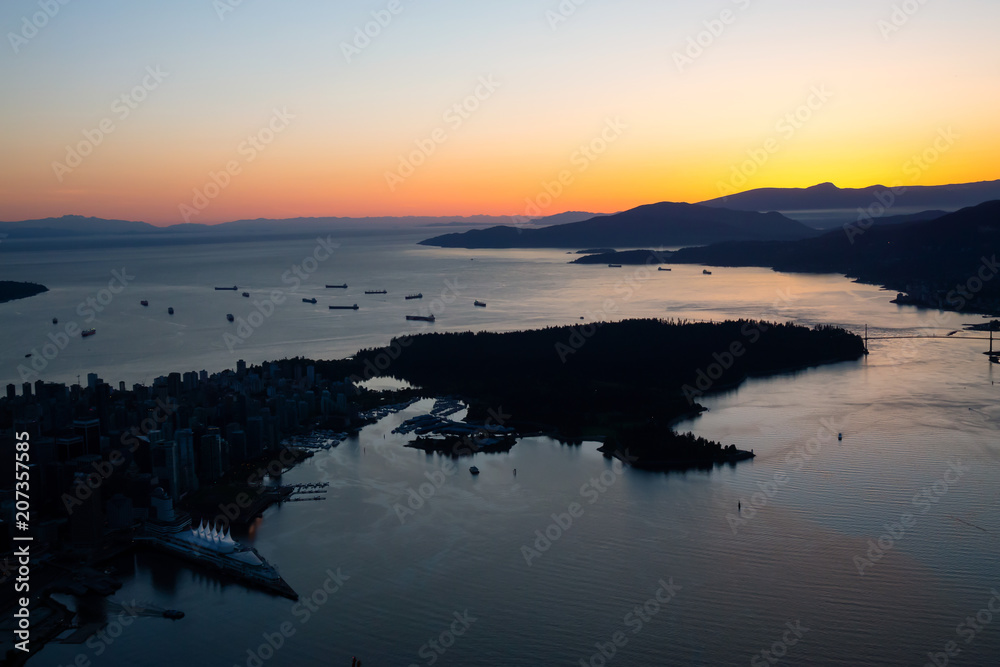 Aerial view of Downtown Vancouver, British Columbia, Canada. Taken during a vibrant sunset.