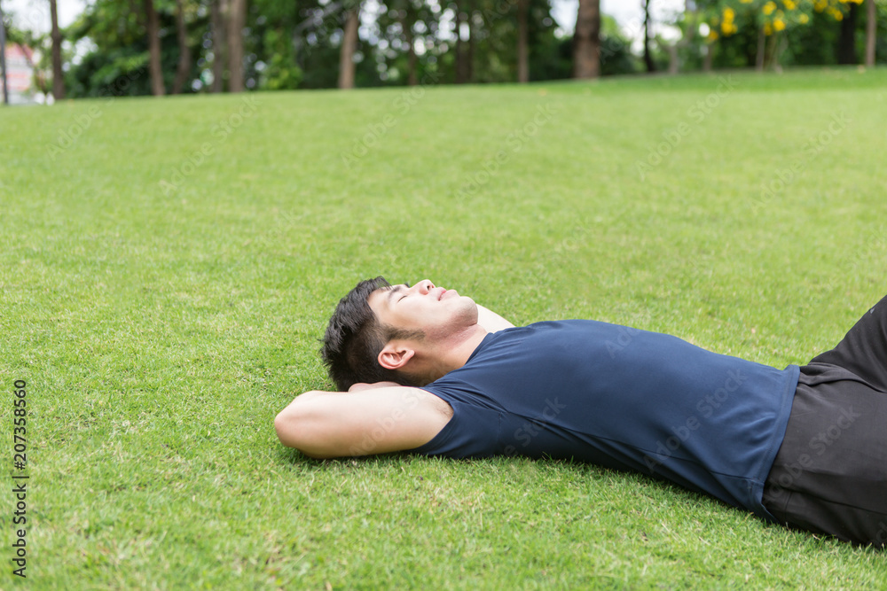 Fitness man have rest after training in park. Fitness man have rest after training in park.