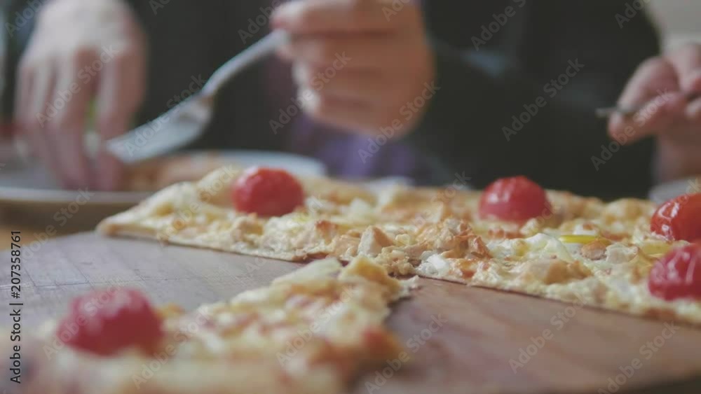 boy teen and girls eats pizza in cafe slow motion video. children eat pizza a delicious pizza. company of people lifestyle friends eating in a cafe. kids eating pizza concept boy teen and girls eats pizza in cafe slow motion video. children eat pizza a delicious pizza. company of people lifestyle friends eating in a cafe. kids eating pizza concept