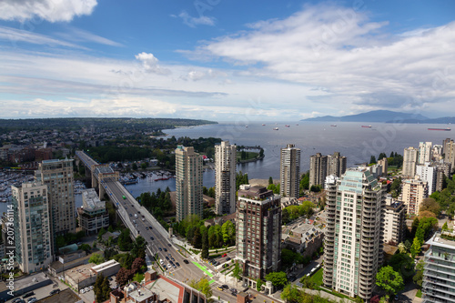 Aerial view of a beautiful modern cityscape during a cloudy day.Taken in Downtown Vancouver, British Columbia, Canada.