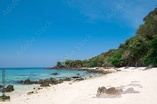 Fototapeta Naklejka Na Ścianę i Meble -  Beautiful white sand beach with  island in summer time concept travel, holiday and vacation. Tropical paradise beach nature landscape in Thailand