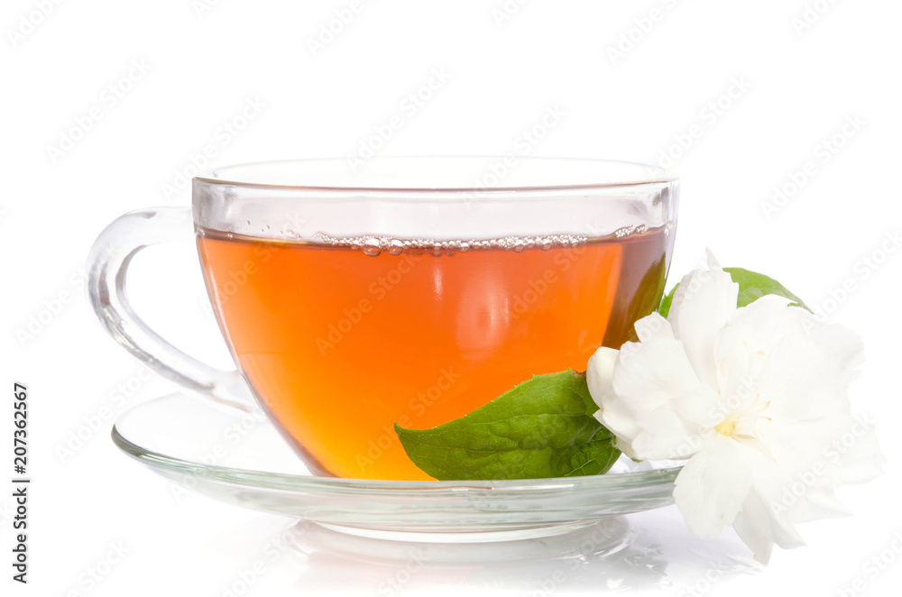 Glass cup of Tea with jasmine flowers and leaves isolated on white background Glass cup of Tea with jasmine flowers and leaves isolated on white background
